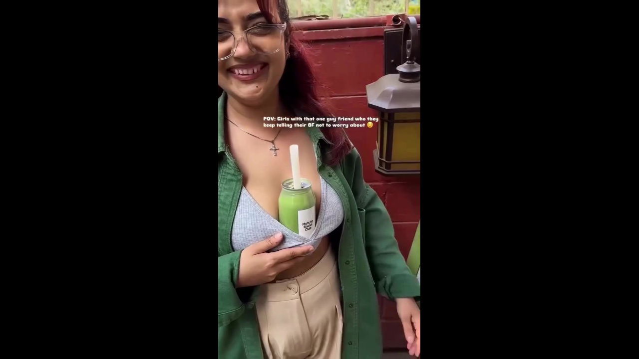 Sexy girl boobs enjoyed by boyfriend drinking juice